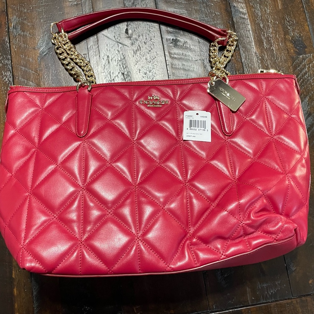Beautiful red Coach handbag in like new condition.